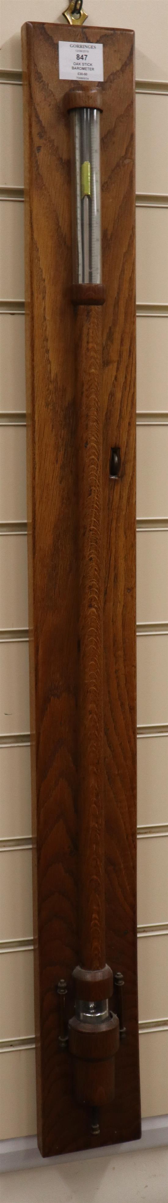 An oak stick barometer with ivory scales H.approx. 105cm